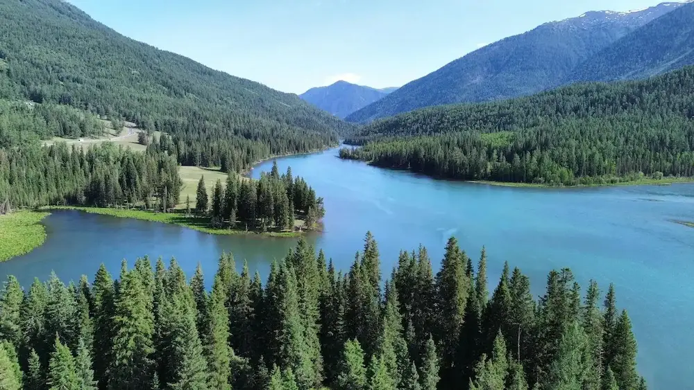 Snow-bound Kanas lake and forested mountain slopes in far northern Xinjiang