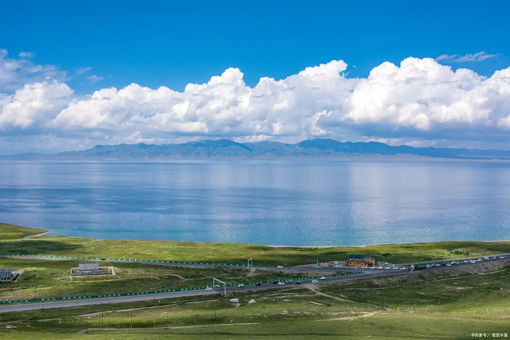 Sayram Lake shoreline with snow-capped mountains